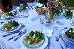 Elegant table set with wedding bouquet salad for a wedding catered by Casa Nova Custom Catering, Santa Fe, NM