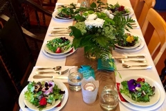 A festive table set with salad first course by Casa Nova Custom Catering, Santa Fe, NM