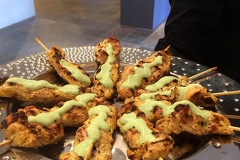 A platter of chicken skewers with avocado crema by Casa Nova Custom Catering, Santa Fe, NM